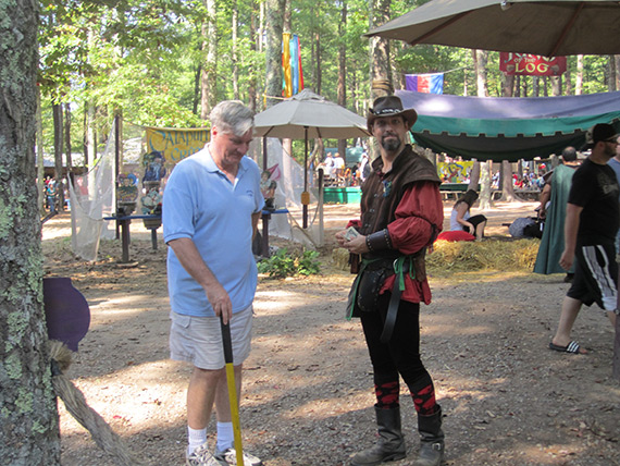 Renaissance characters interact with fair goers